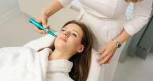 professional preparing a syringe for a collagen stimulator injection to restore facial volume and structure